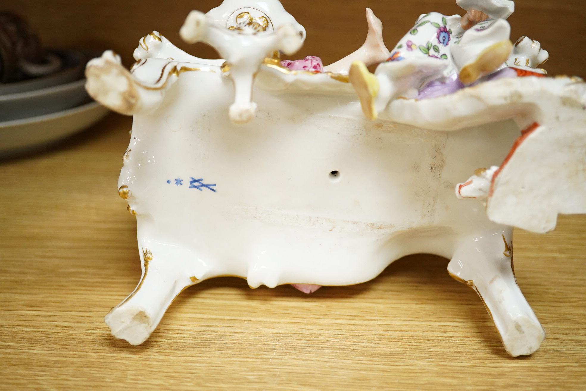 A Meissen style porcelain figure group ‘Discovered Lover’, 19cm wide